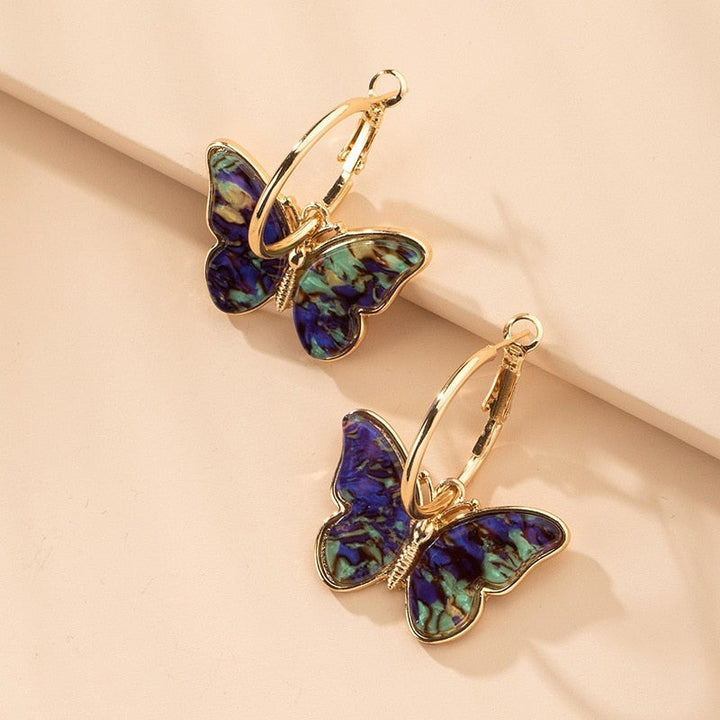 Natalia Paz | Aros de argolla con mariposa multicolor