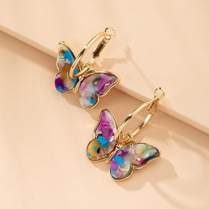 Natalia Paz | Aros de argolla con mariposa multicolor