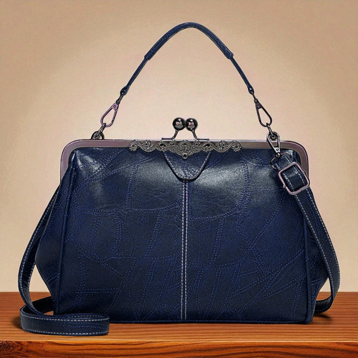 Delfina | Cartera vintage con cierre de beso