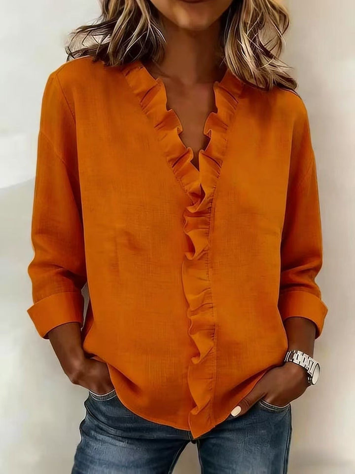 Ana Belén | Blusa elegante escote en V con vuelos
