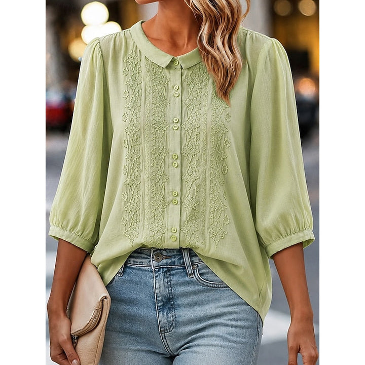 Clara | Blusa con cuello bebé y bordado frontal