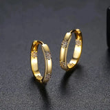 Raiquilaf | Aros circulares vintage con detalle floral
