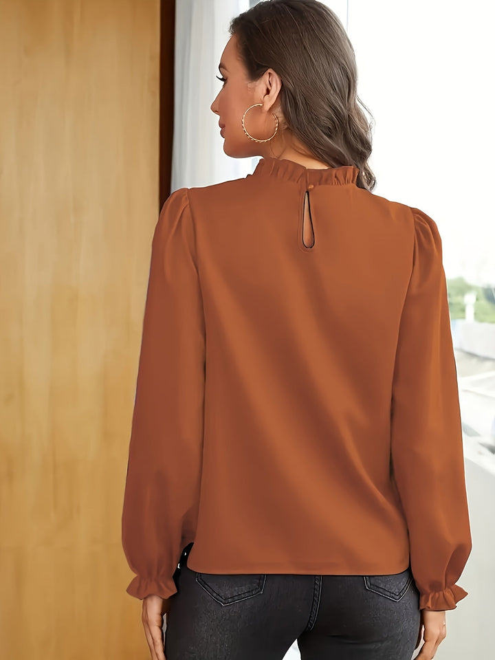 Melanie | Blusa de cuello alto con volantes y mangas abullonadas