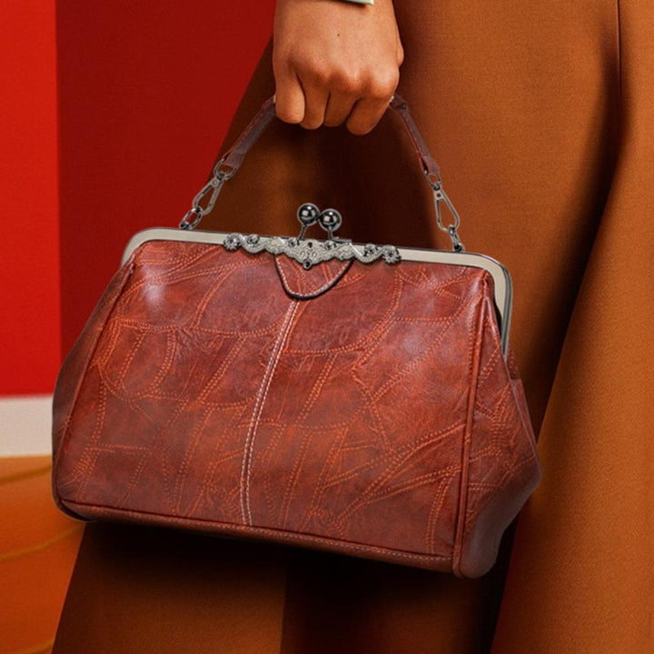 Delfina | Cartera vintage con cierre de beso