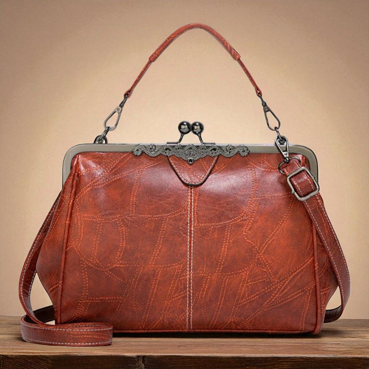 Delfina | Cartera vintage con cierre de beso