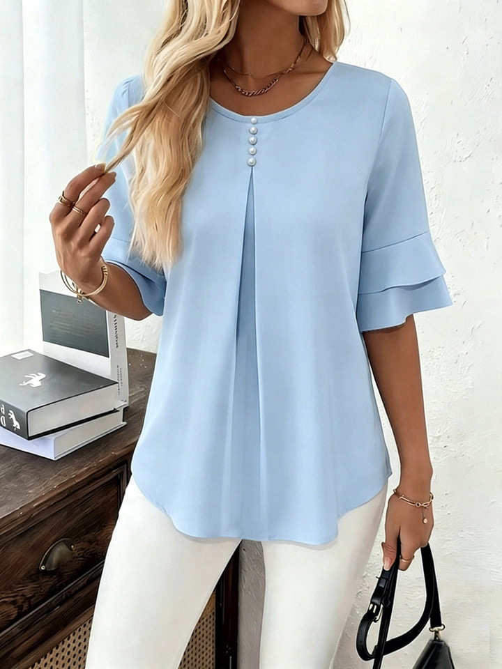 Naomi | Blusa plisada de mangas acampanadas