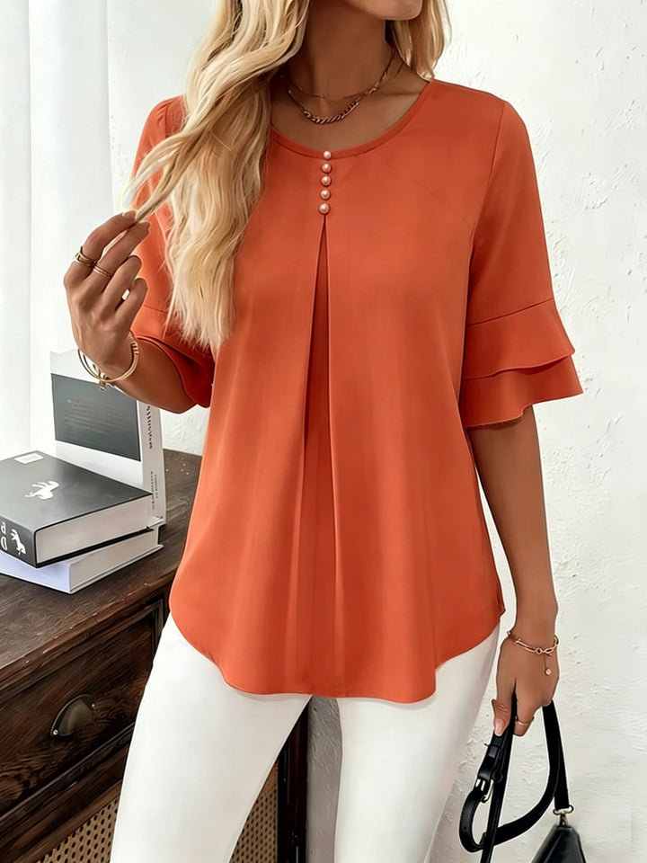 Naomi | Blusa plisada de mangas acampanadas