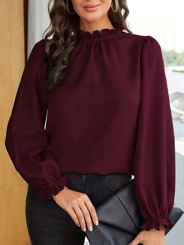 Melanie | Blusa de cuello alto con volantes y mangas abullonadas