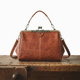 Delfina | Cartera vintage con cierre de beso