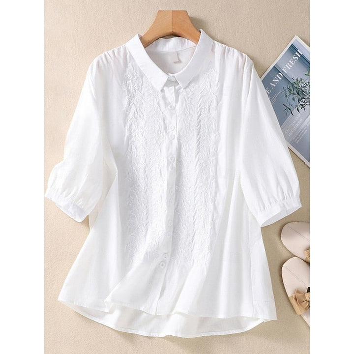 Clara | Blusa con cuello bebé y bordado frontal