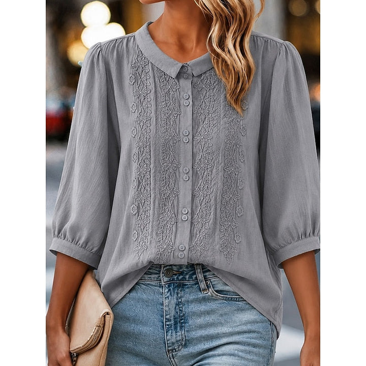 Clara | Blusa con cuello bebé y bordado frontal