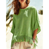 Noelia Paz | Blusa holgada con ruedo de flecos