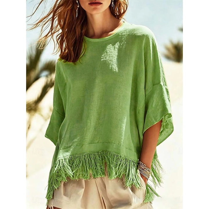 Noelia Paz | Blusa holgada con ruedo de flecos