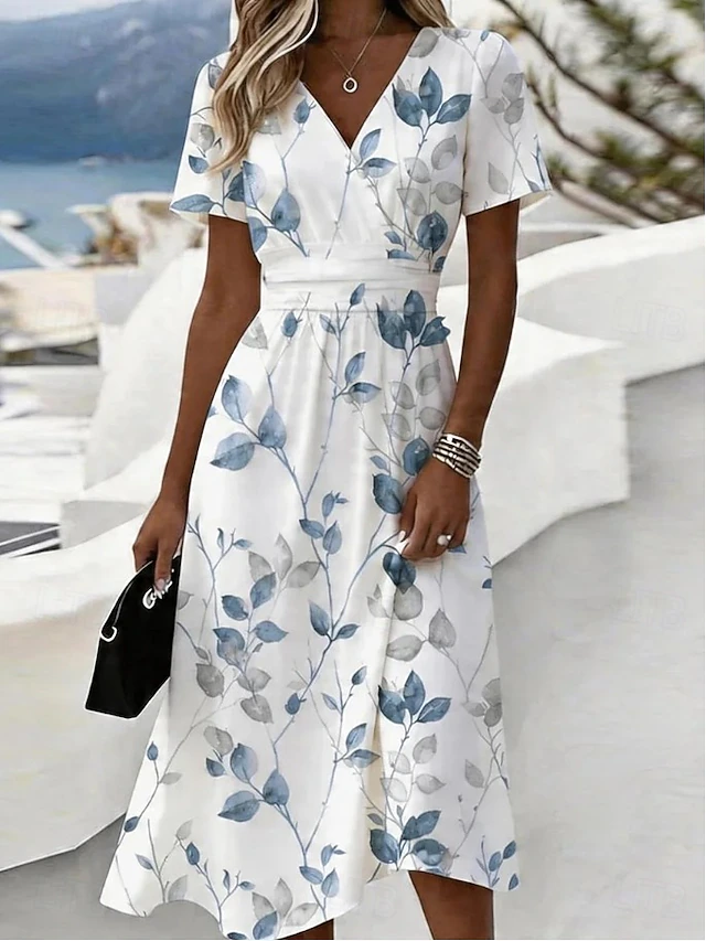 Noelia | Vestido midi vaporoso con estampado de hojas