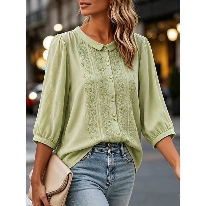 Clara | Blusa con cuello bebé y bordado frontal