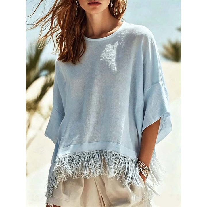 Noelia Paz | Blusa holgada con ruedo de flecos