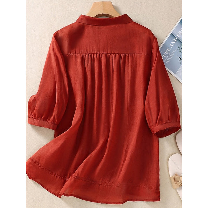 Clara | Blusa con cuello bebé y bordado frontal