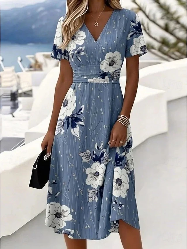 Noelia | Vestido midi vaporoso con estampado de hojas