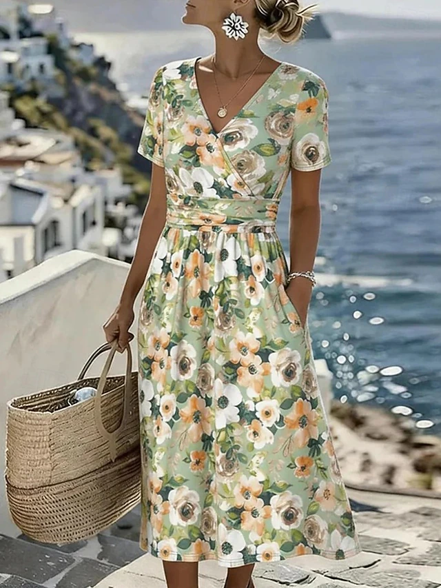 Noelia | Vestido midi vaporoso con estampado de hojas
